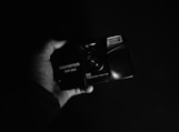 black nikon point and shoot camera