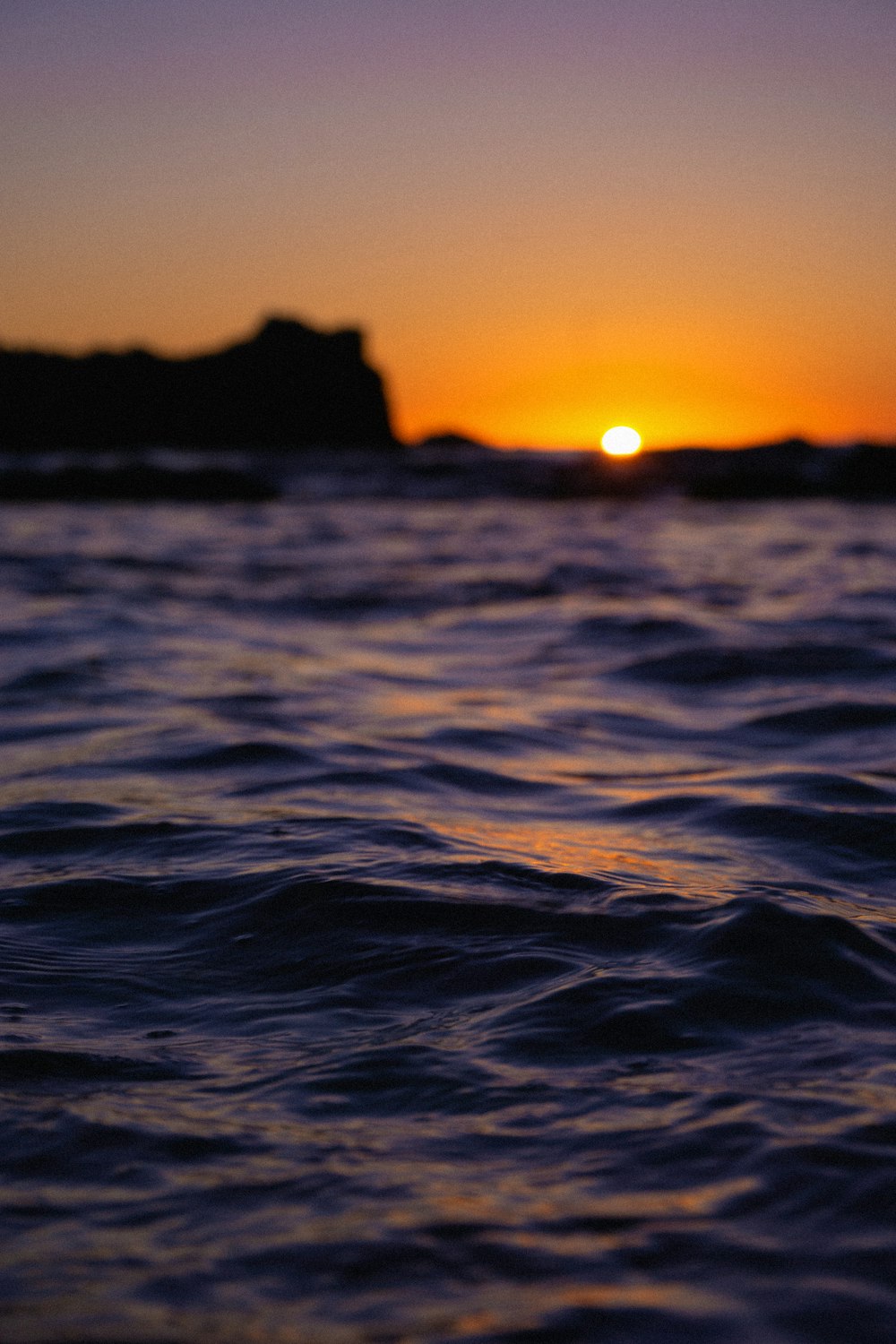 body of water during sunset