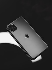 black iphone 7 plus on white surface
