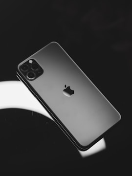 black iphone 7 plus on white surface
