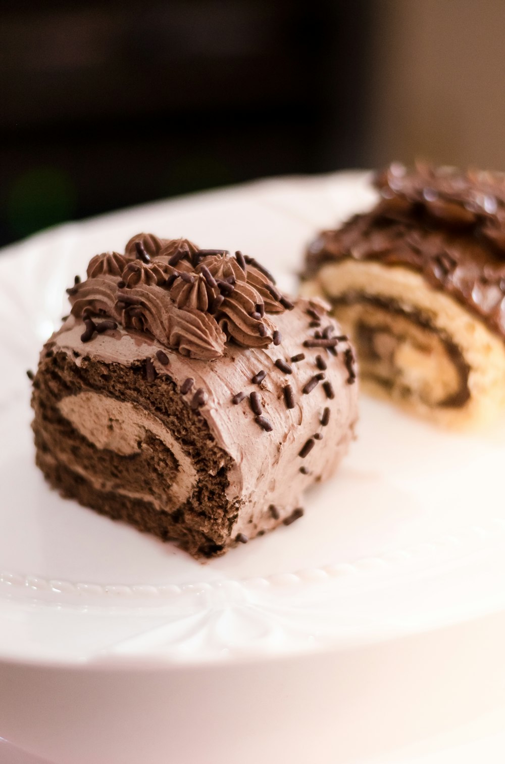 chocolate cupcake on white ceramic plate