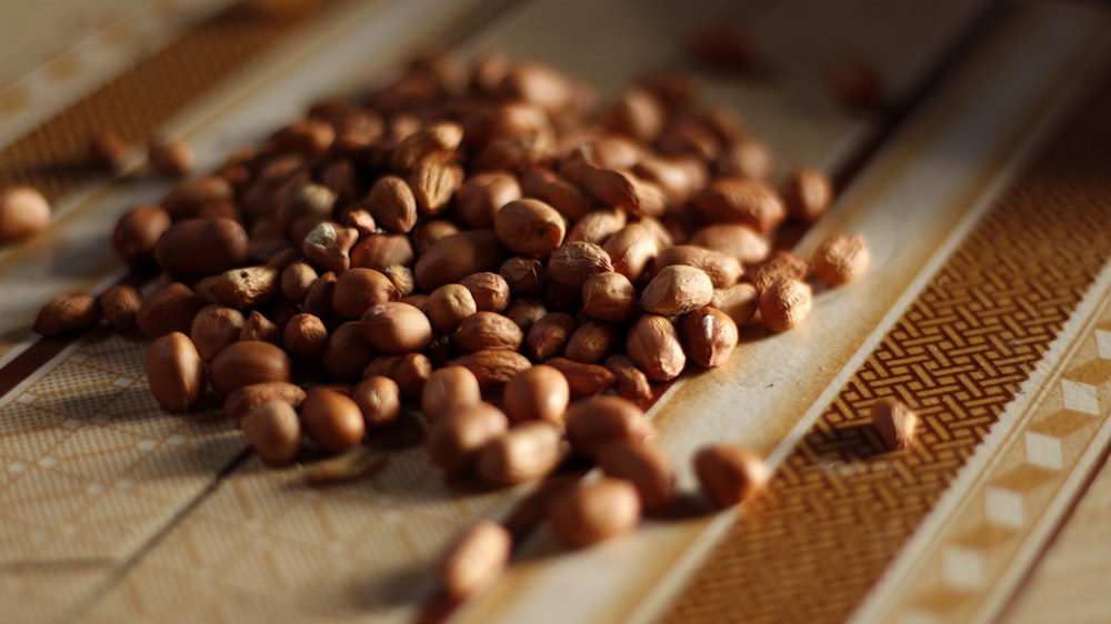 brown coffee beans on brown wooden chopping board