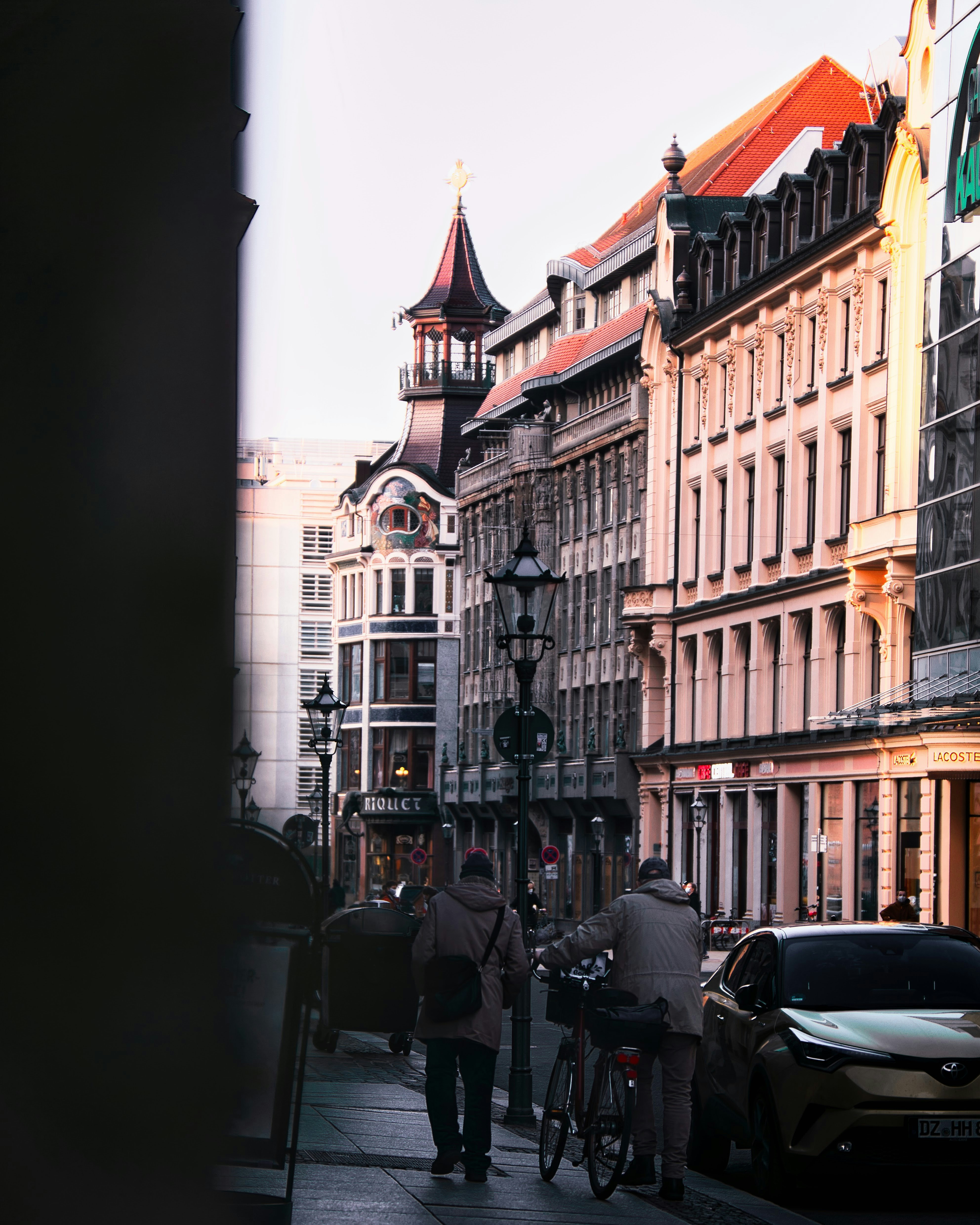 black motorcycle parked in front of brown concrete building