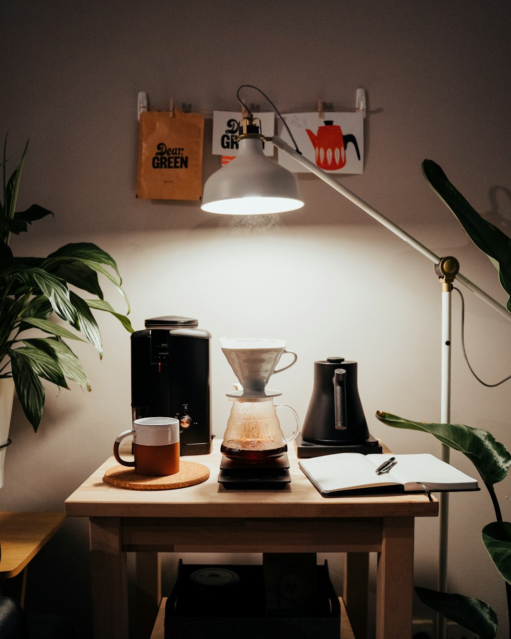 black coffee maker on brown wooden table