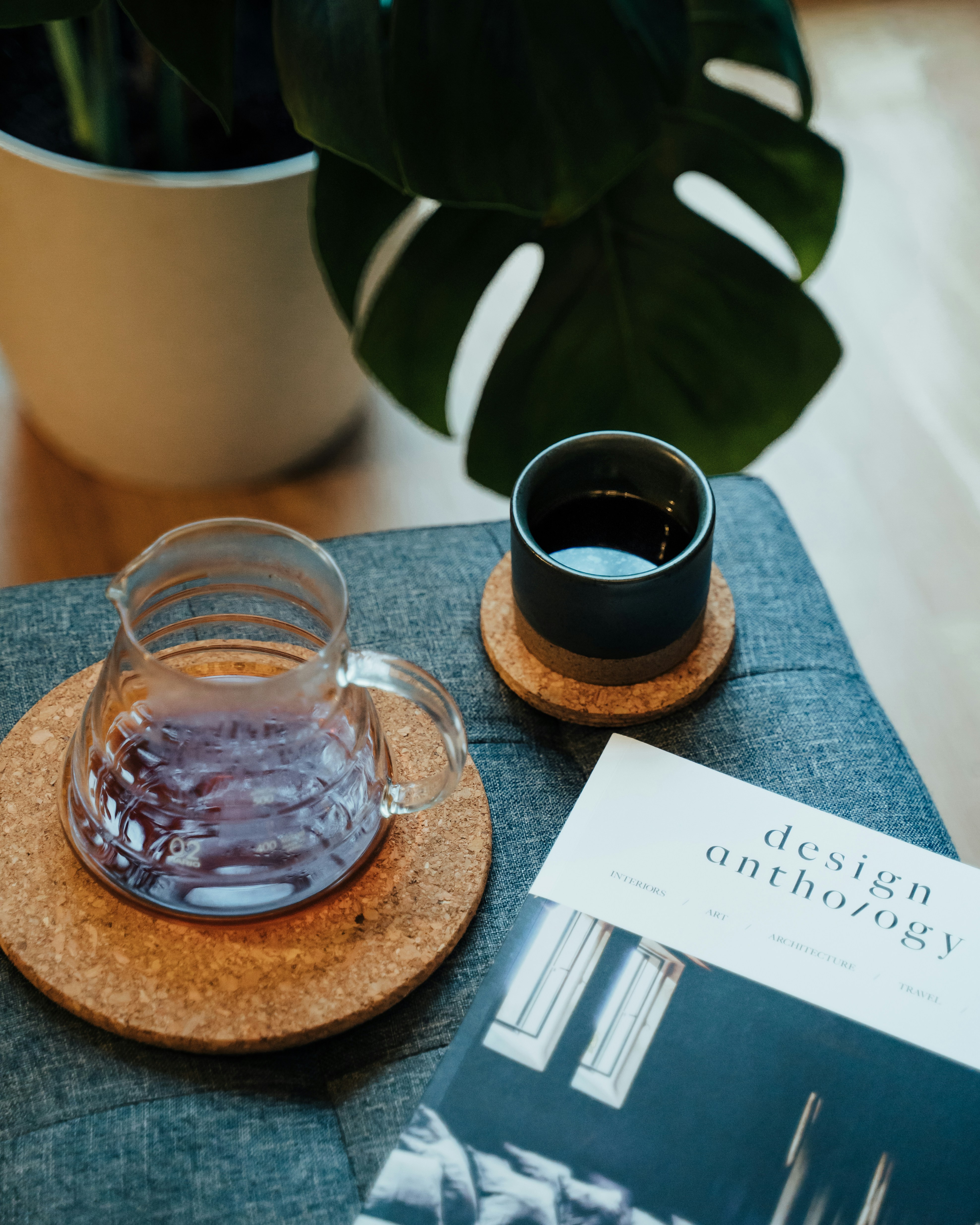 clear glass mug on brown wooden coaster