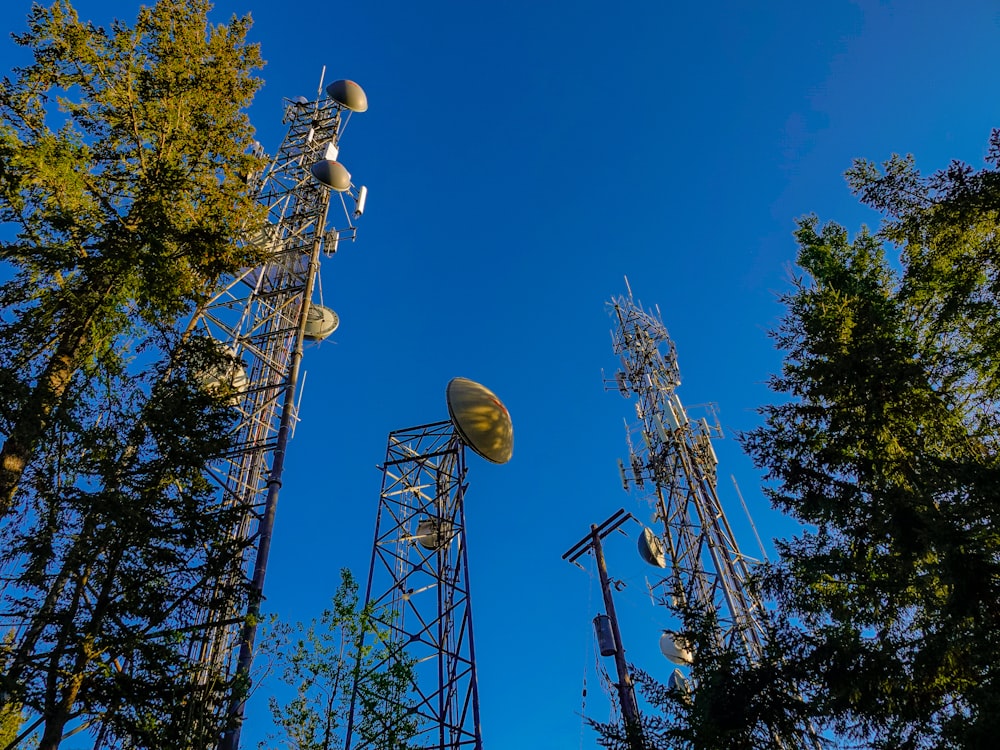 brown and white electric tower under blue sky during daytime