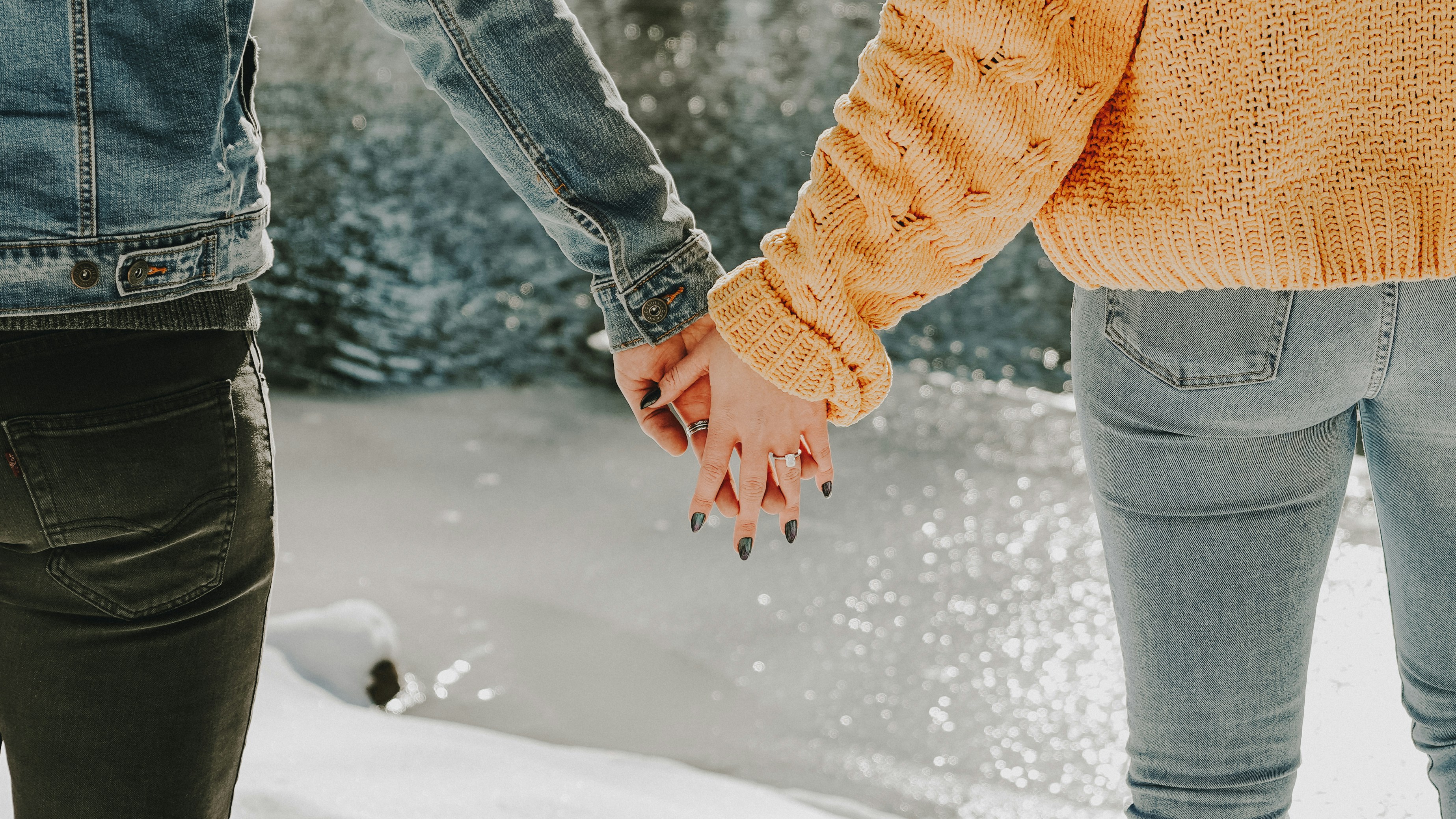 A happy couple laughing and engaging in an unexpected, fun activity together to reconnect and bridge emotional distance.