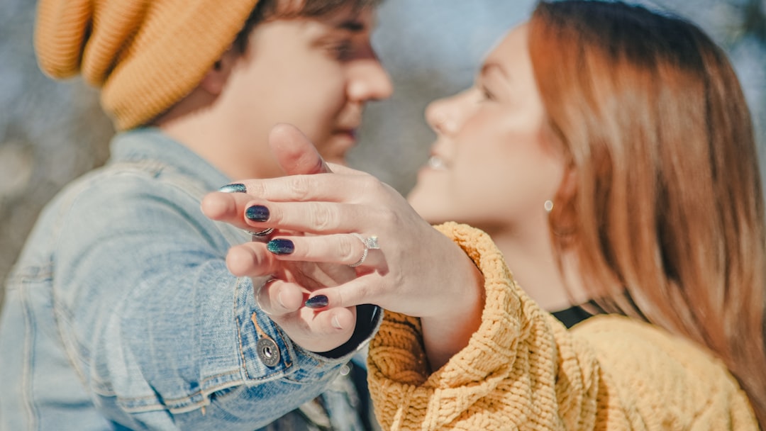 woman in yellow knit sweater and blue denim jeans