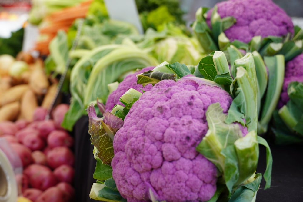 purple and green vegetable on brown wooden table