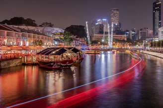 red and brown boat on river during night time
