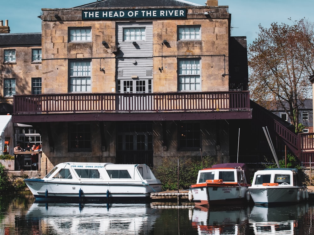 white and red boat on river during daytime