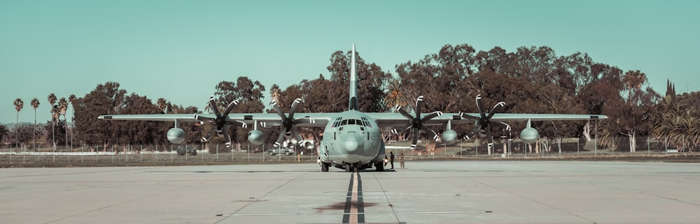 gray fighter plane on gray concrete ground during daytime