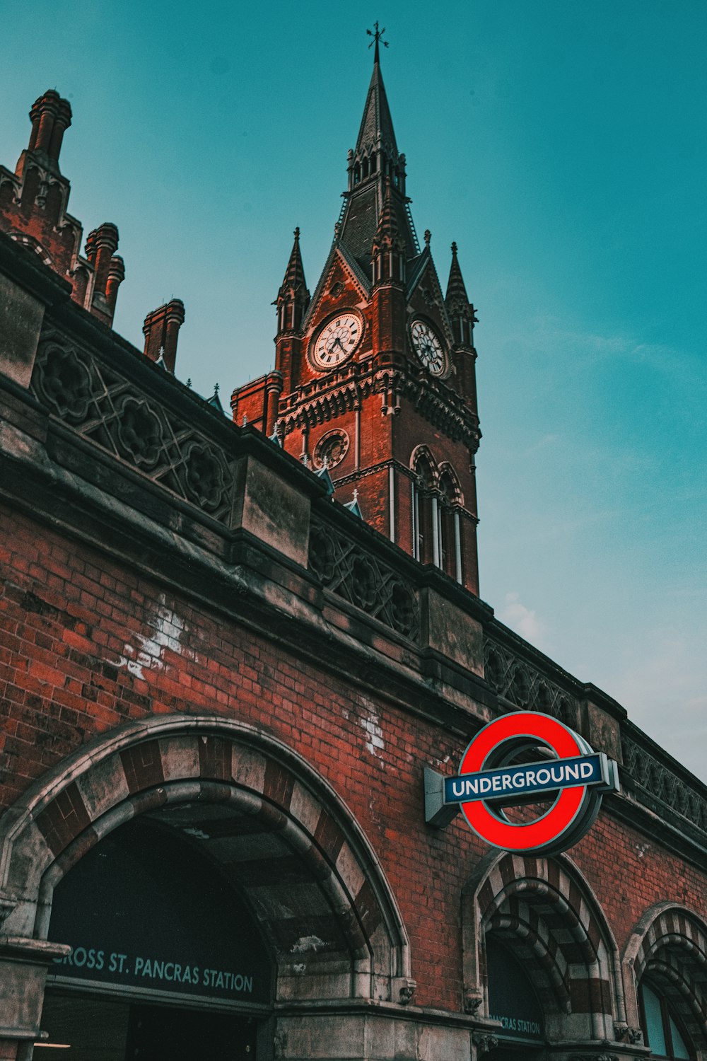 brown brick building with clock