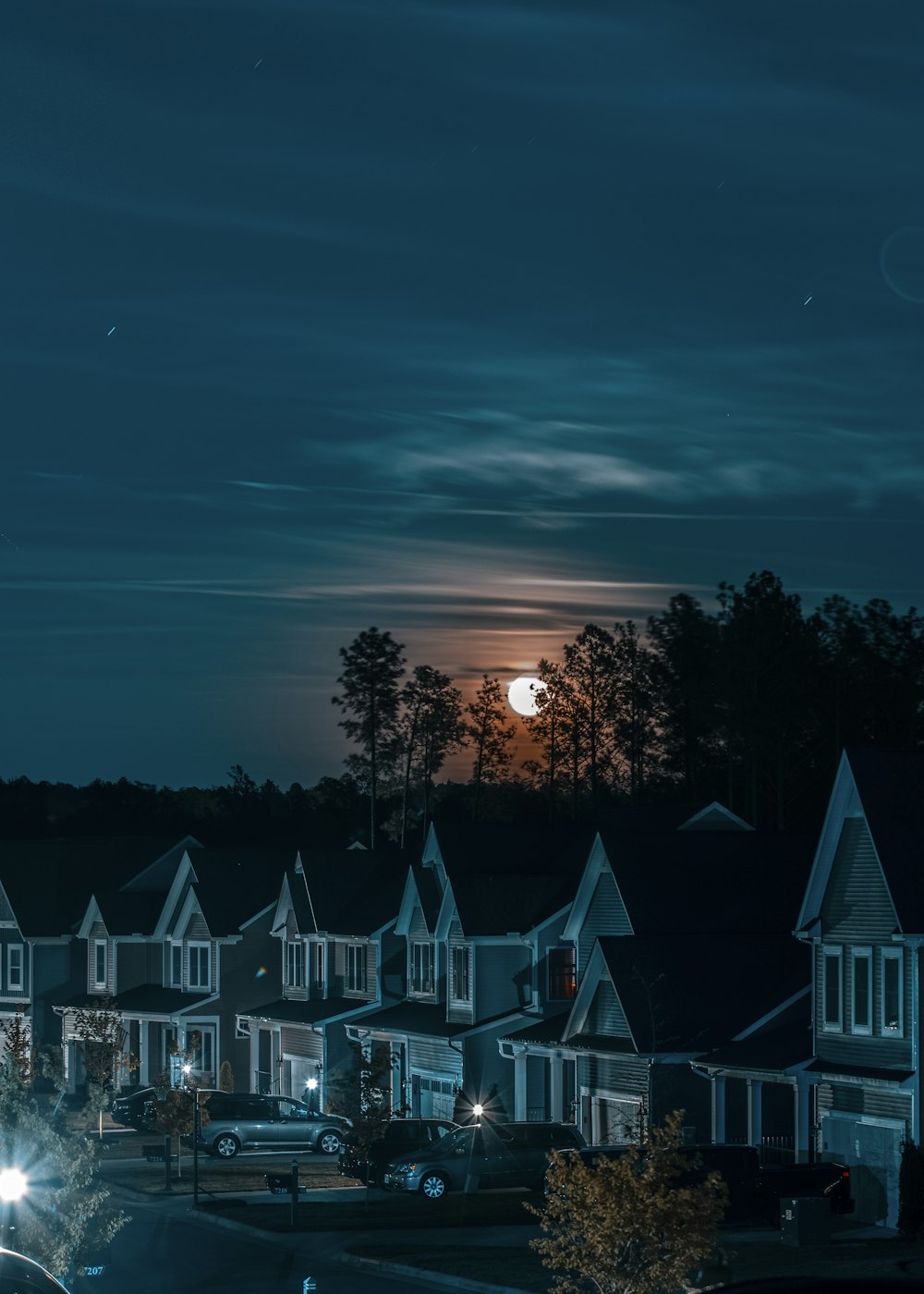 green and white houses during night time