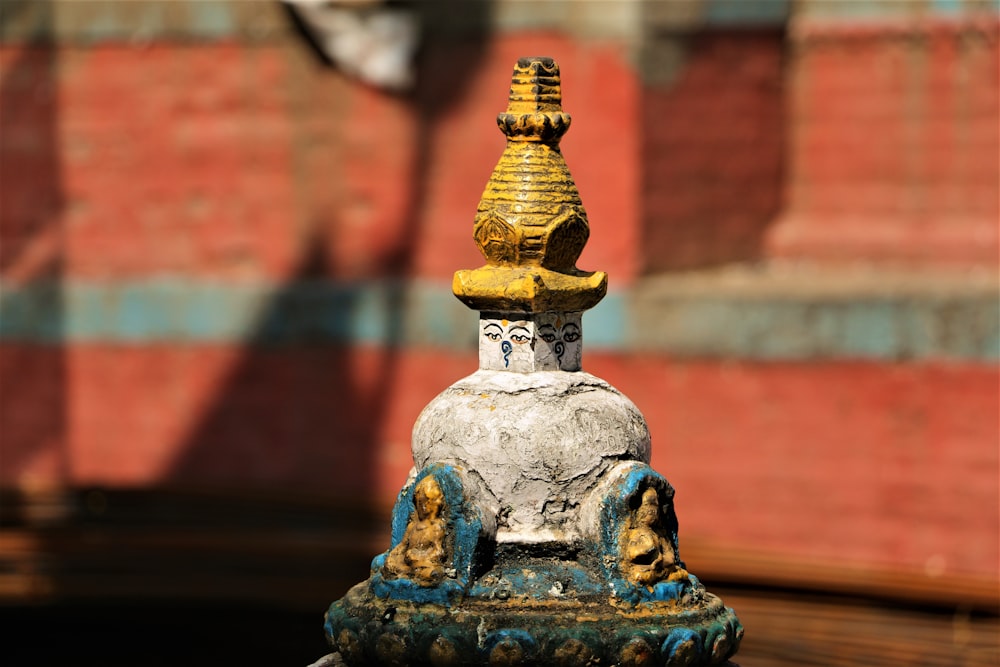 blue and gold buddha figurine