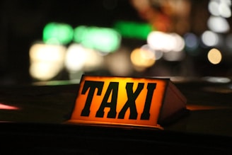 orange and black taxi sign