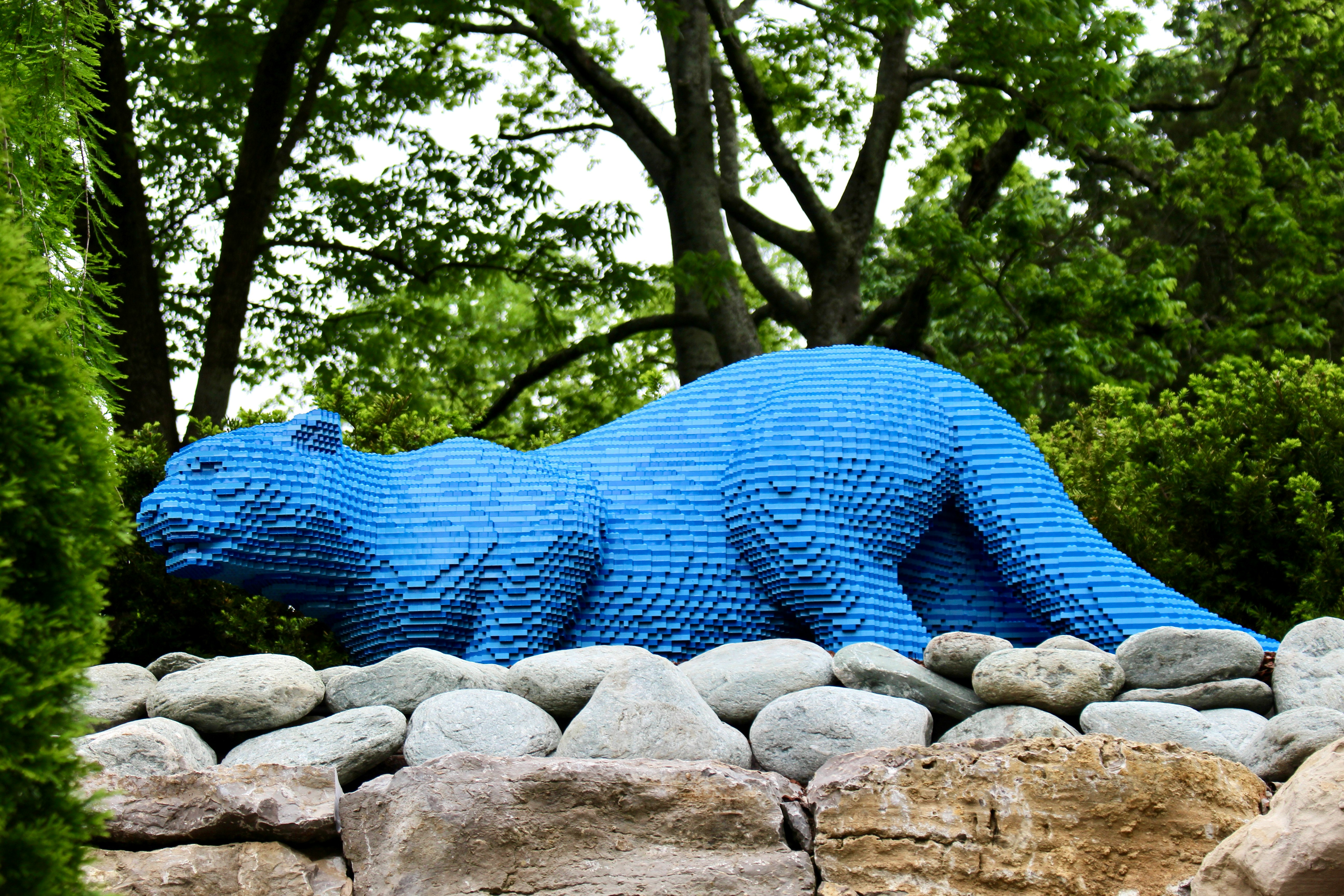 blue dragon statue on gray rock