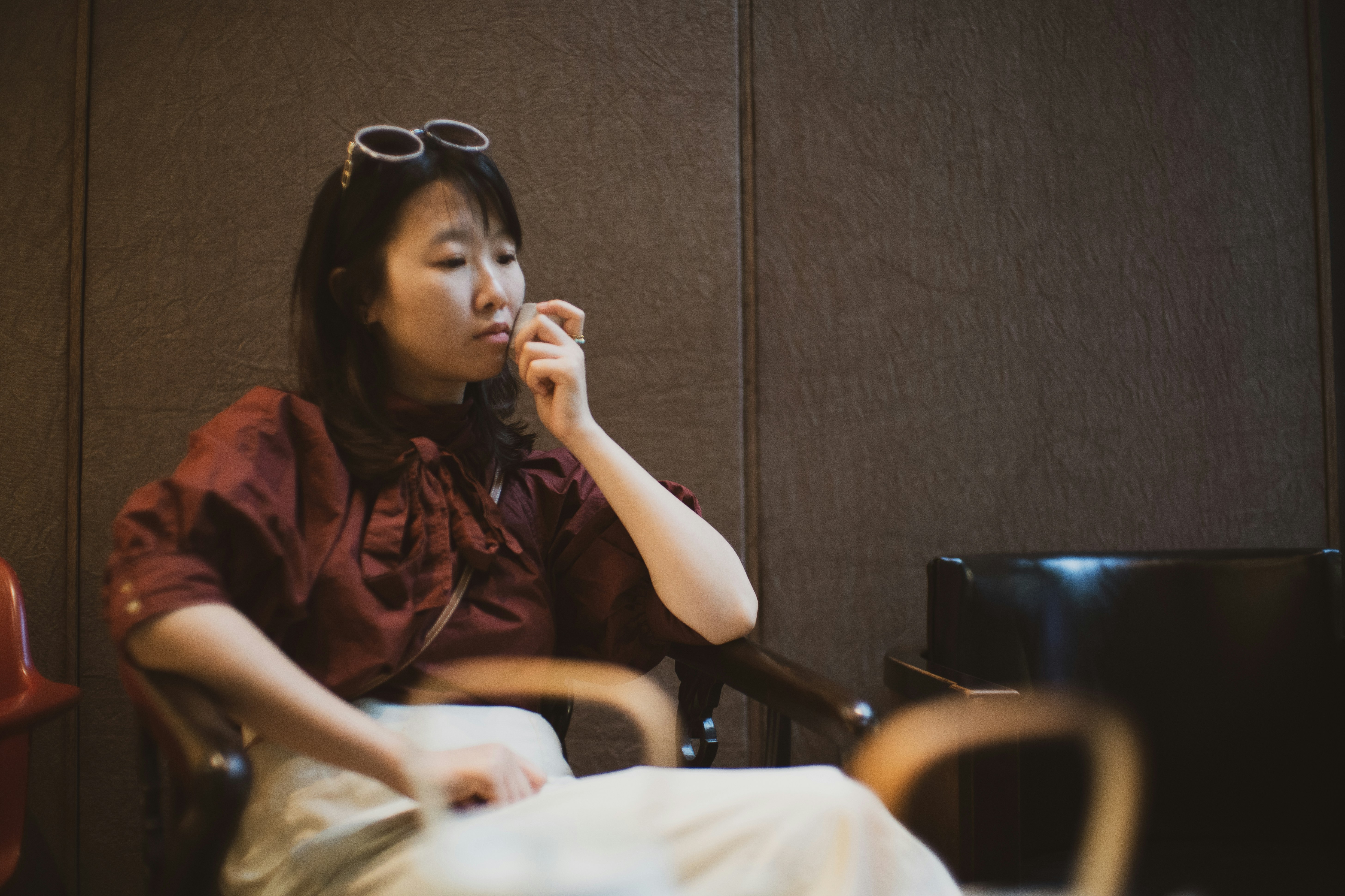 woman in red button up shirt wearing sunglasses