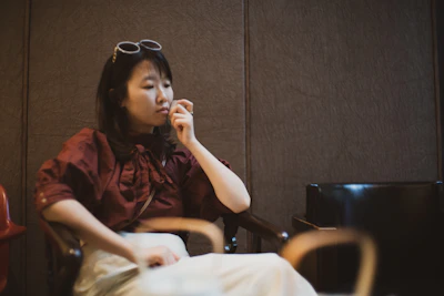 Portrait of a thoughtful woman in a bright office, symbolizing leadership at CLAP.