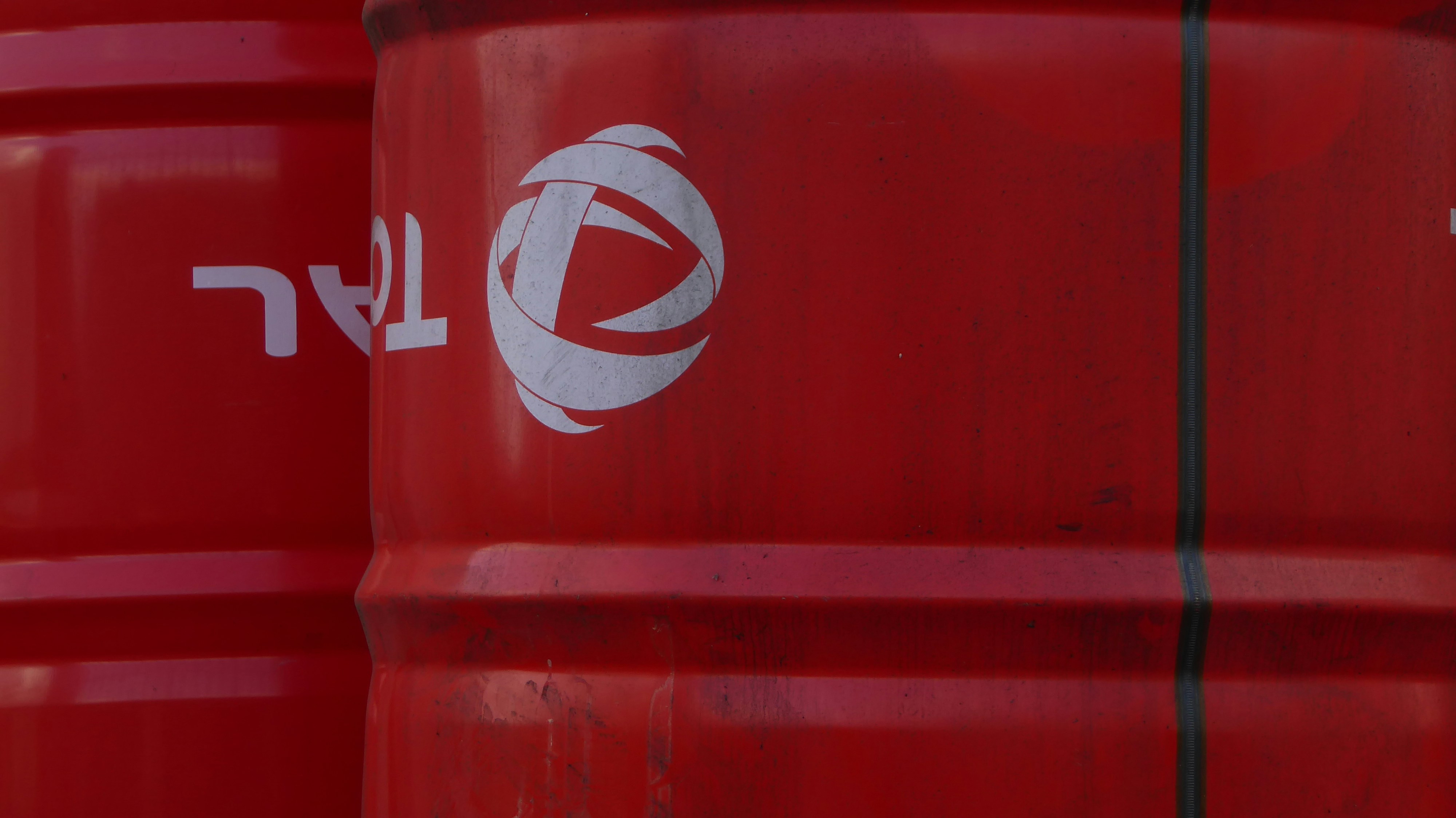 red and white coca cola plastic container