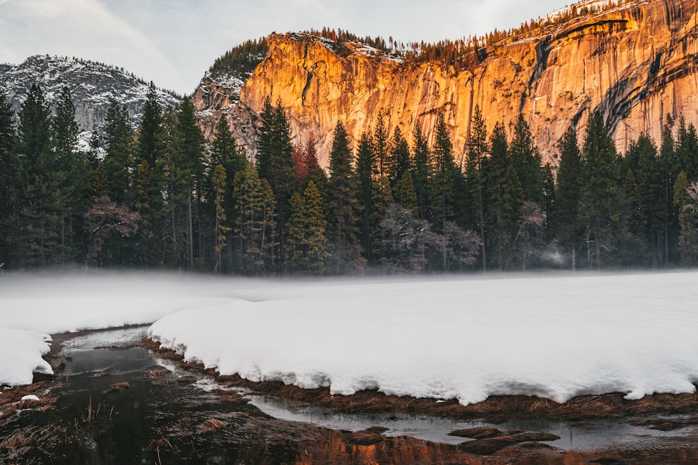 brown rocky mountain with snow