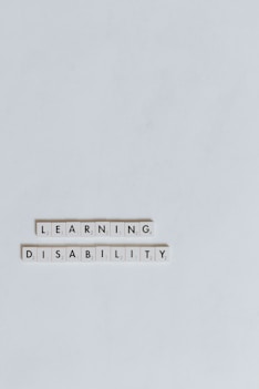 a computer keyboard with the words learning disability spelled on it