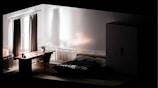 A serene bedroom featuring a stylish bed and minimalist decor.