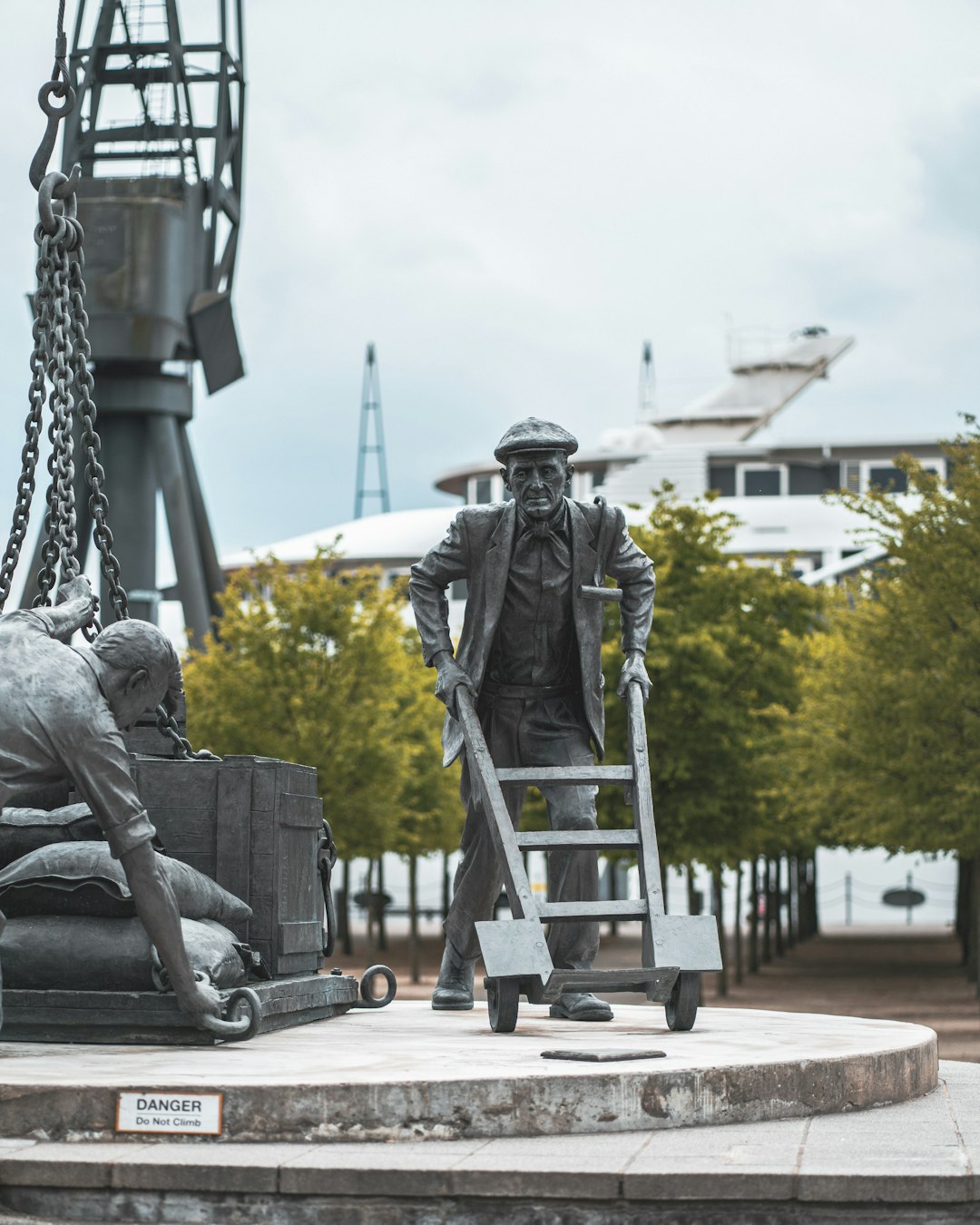 man in black suit statue