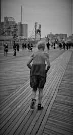 A confident middle-aged man jogging outdoors at sunrise, embodying renewed energy.