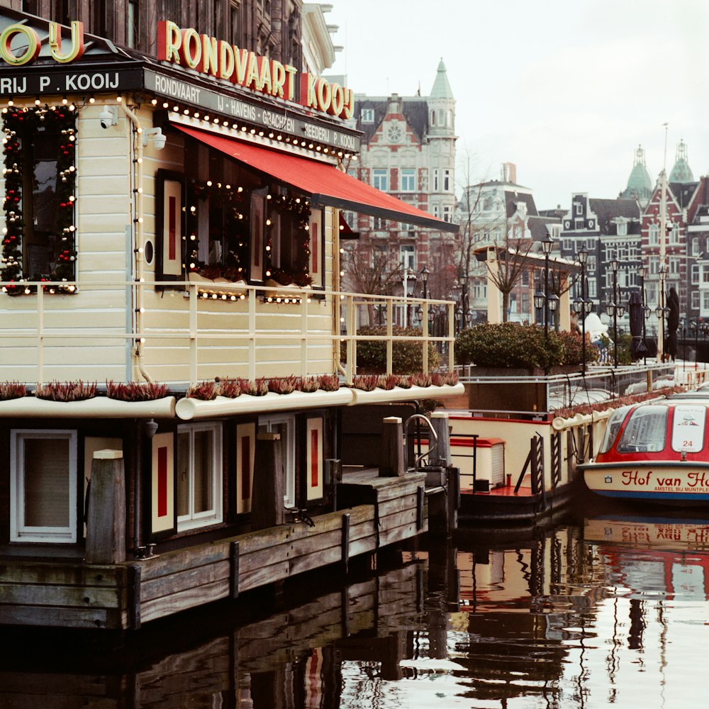 white and red boat on river during daytime