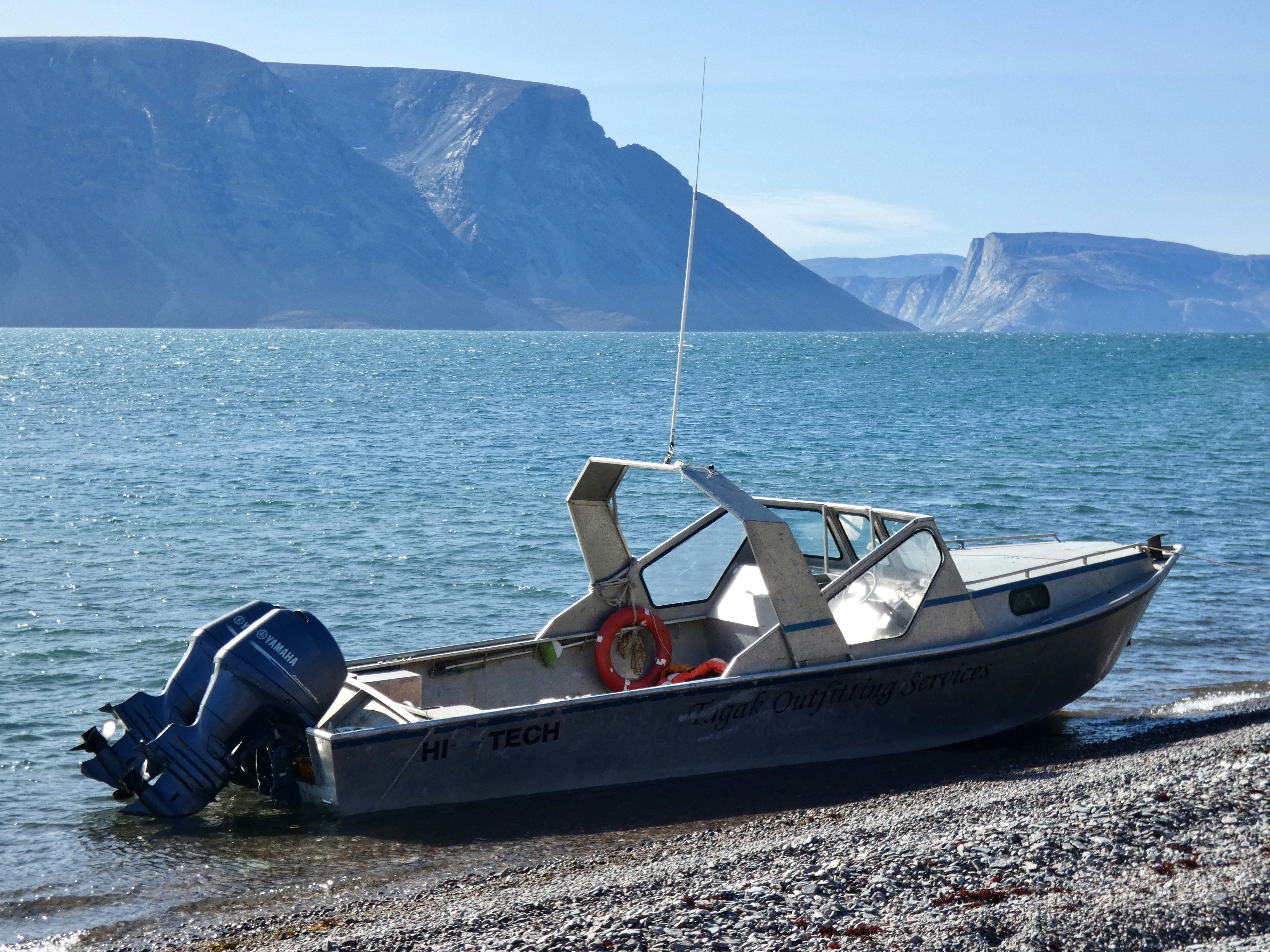 white and red boat on sea during daytime