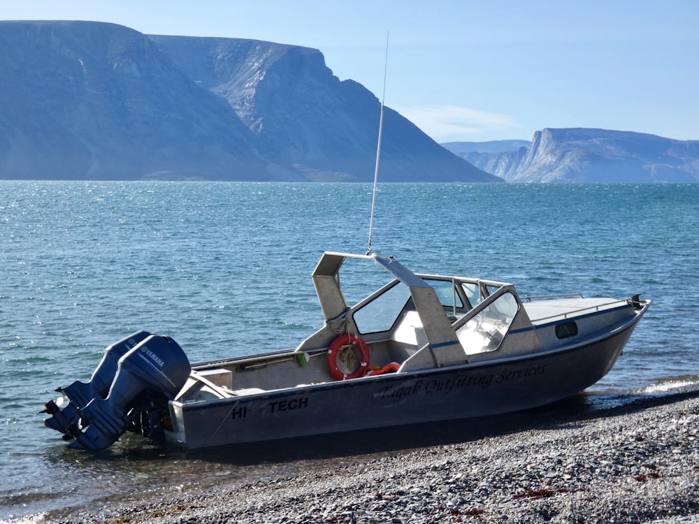 white and red boat on sea during daytime