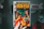 Close-up of hands flipping through a CGC graded comic with vibrant cover art.