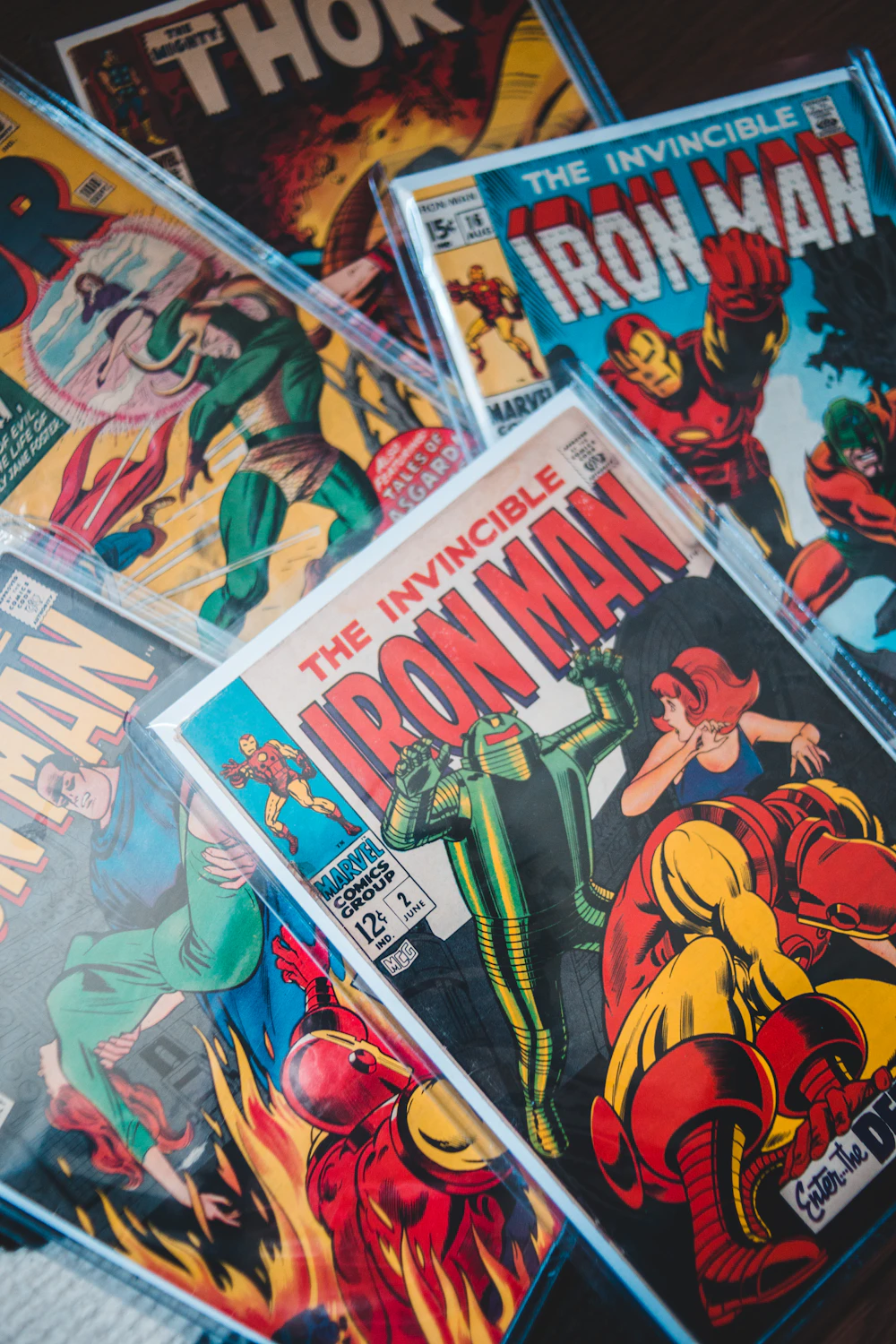Pile of comic issues fanned across a table