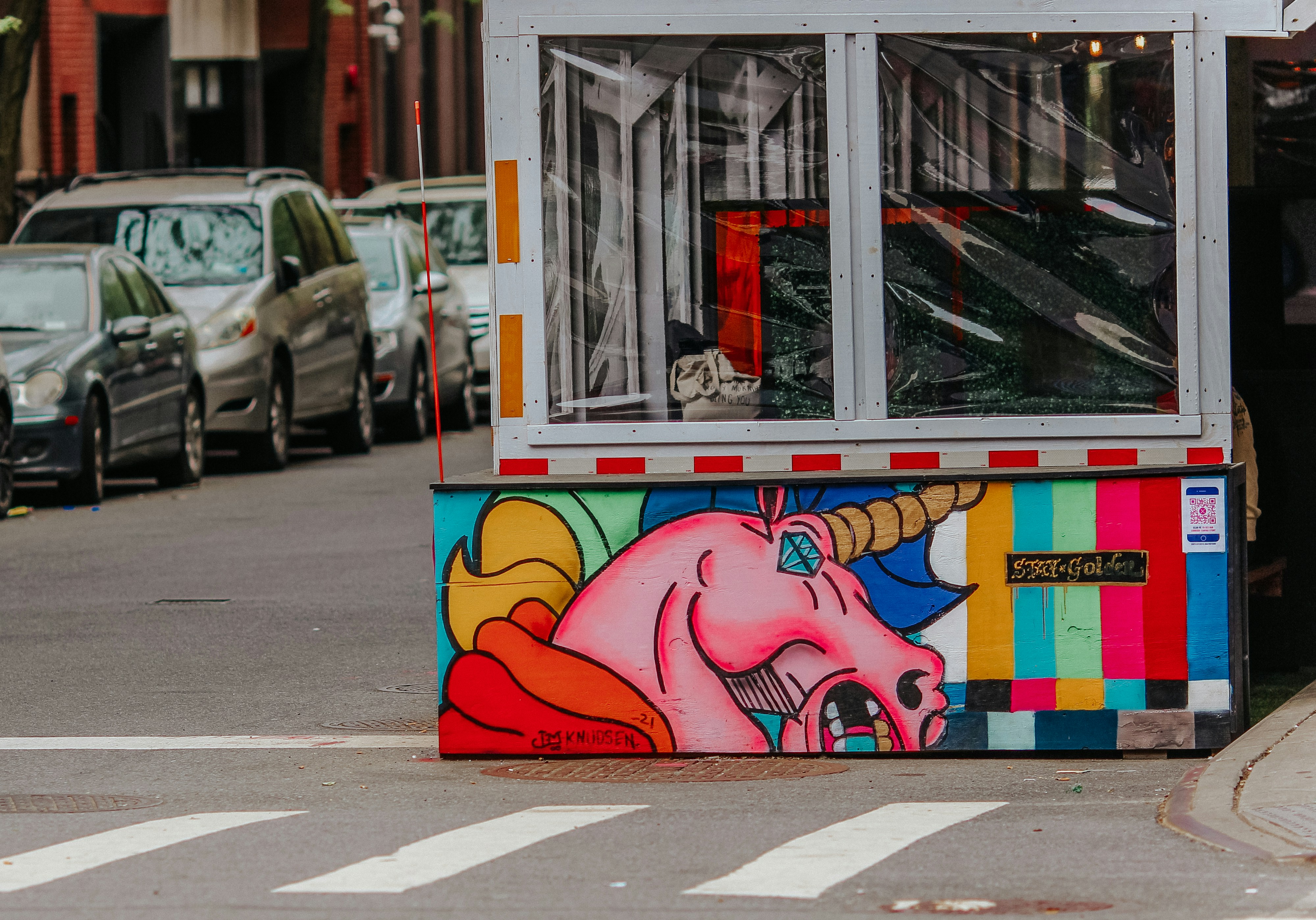 unicorn startup valuation growth - pink and blue elephant graffiti on wall