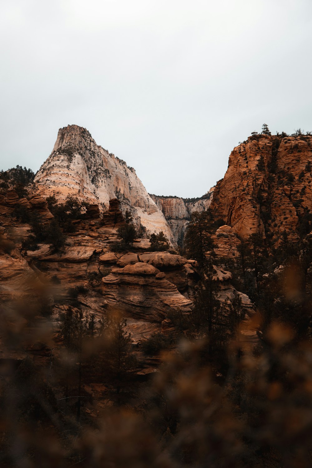 brown rocky mountain under white sky during daytime