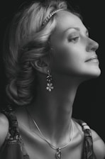 Elegant portrait of Mme Berrada in a sleek black and gold setting, embodying confidence and expertise.