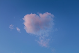 A cute illustration of pastel-colored clouds and hearts.
