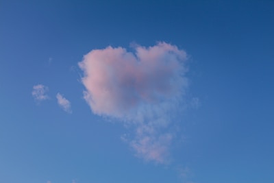 A cute illustration of pastel-colored clouds and hearts.