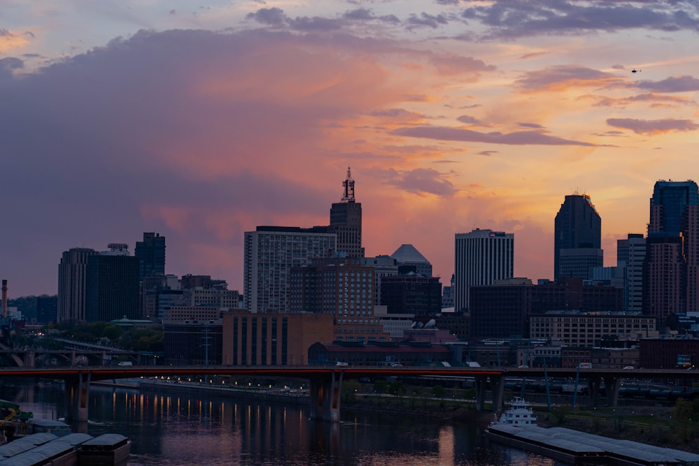 city skyline during sunset with bridge