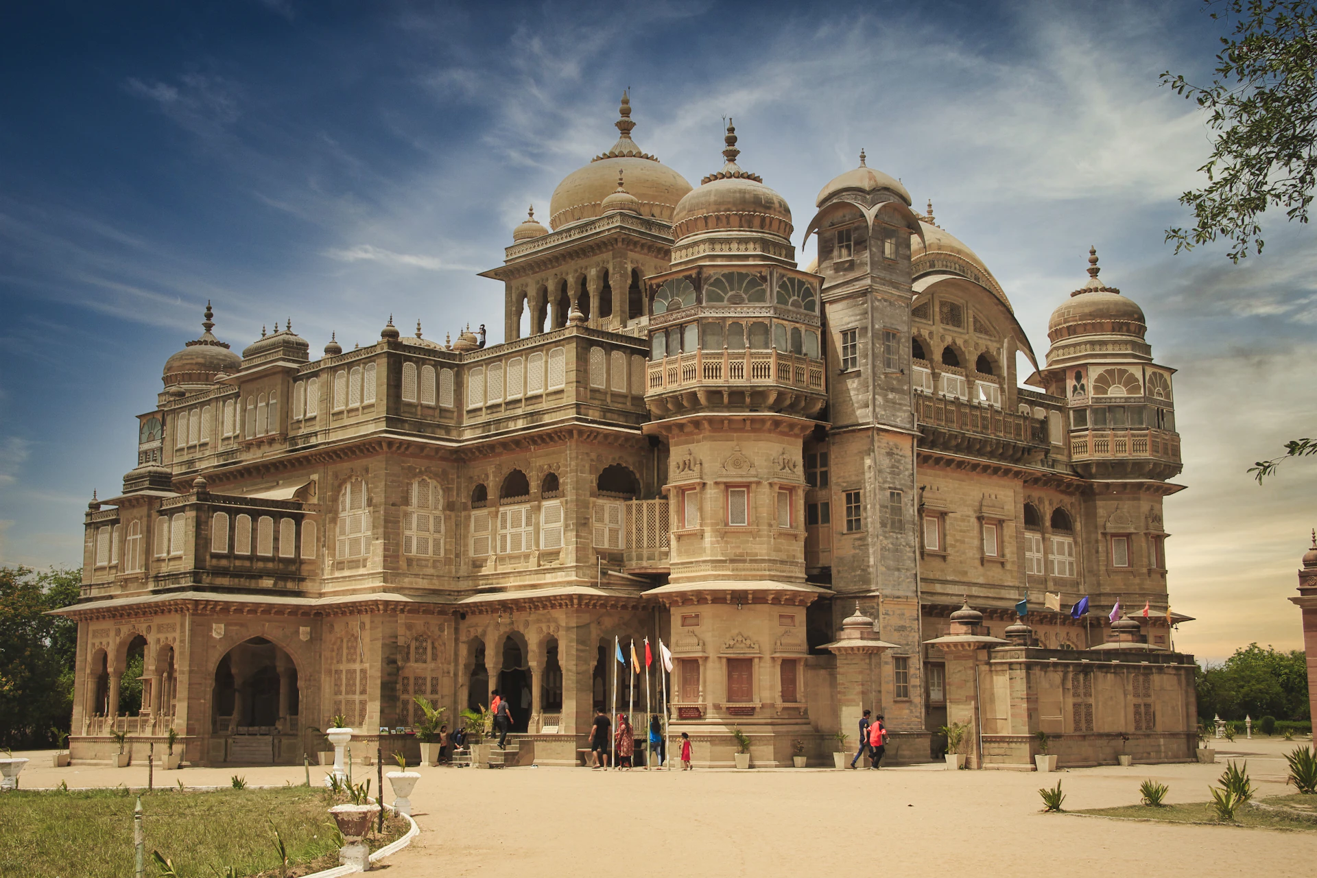People walking near a Gujarat heritage building