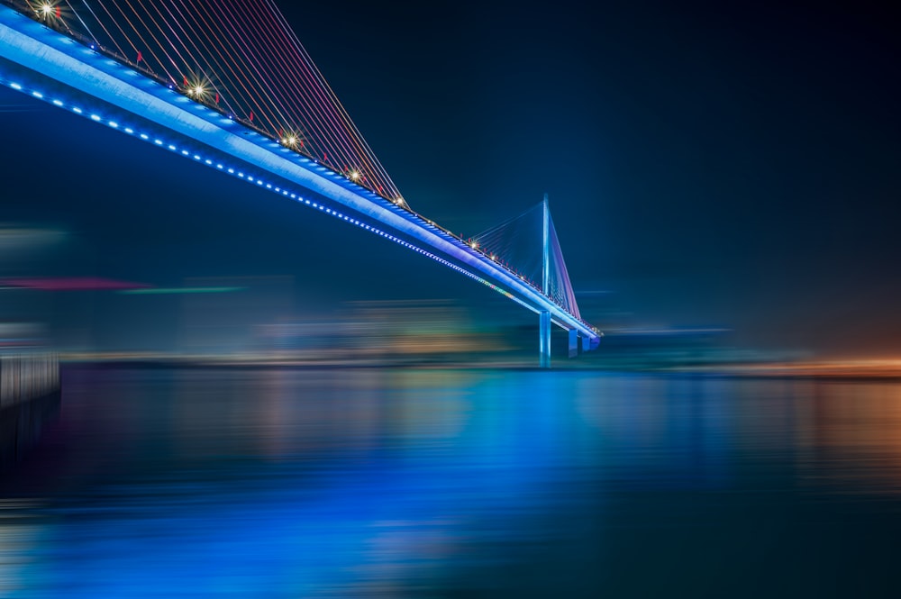 blue and white bridge over water