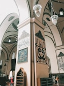 A close-up of intricate calligraphy decorating the mosque’s prayer hall.