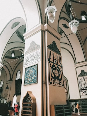 A close-up of intricate calligraphy decorating the mosque’s prayer hall.