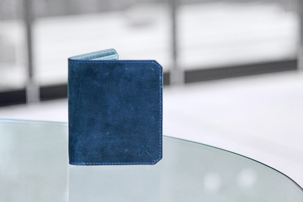 blue tablet computer on white table