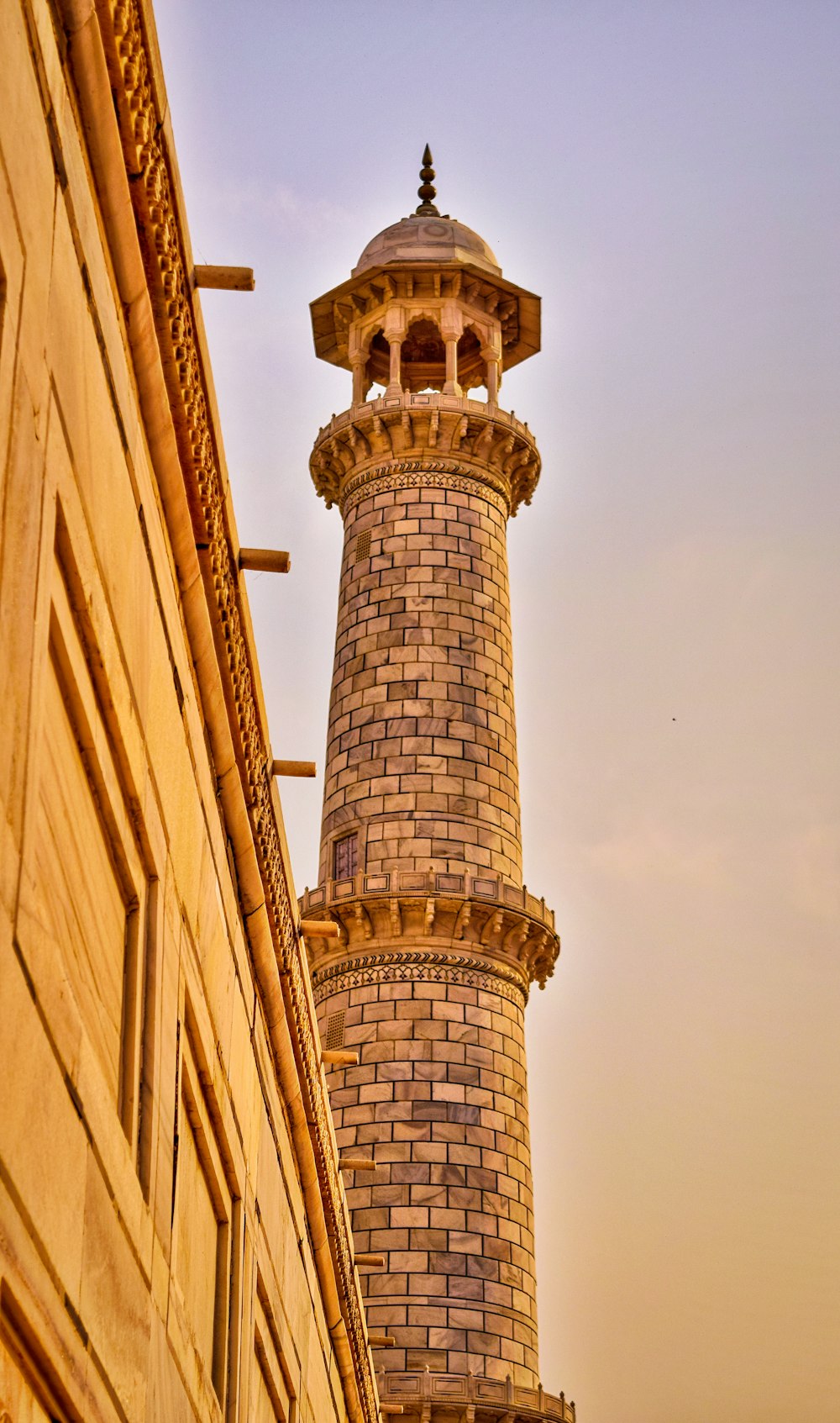 brown concrete tower under white sky during daytime