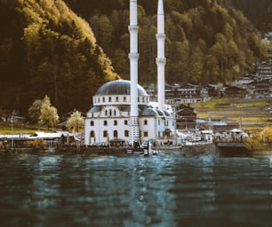 white and green dome building near body of water during daytime