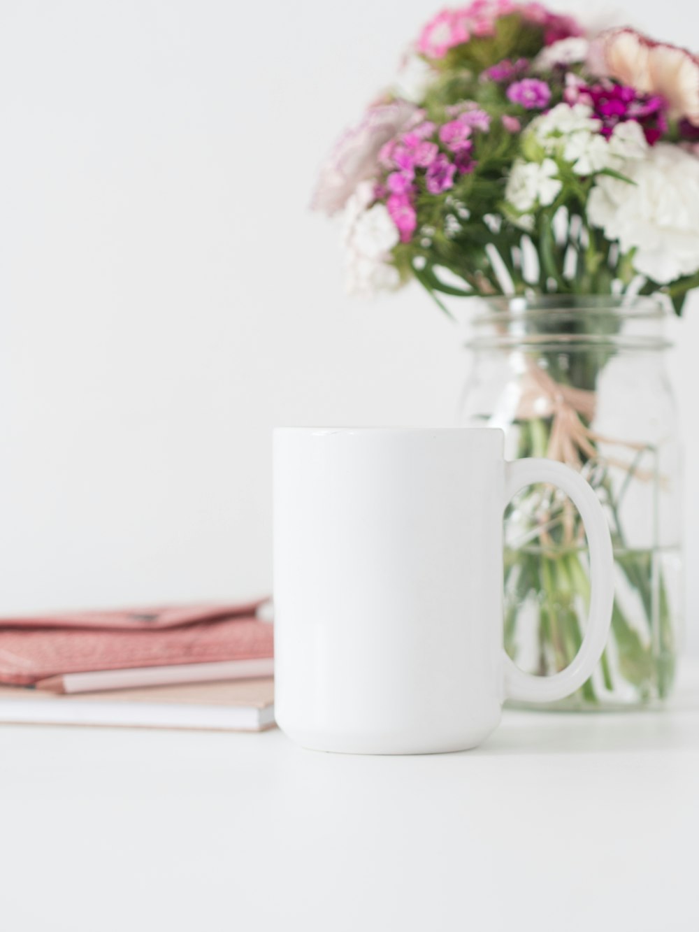 white ceramic mug on white ceramic saucer