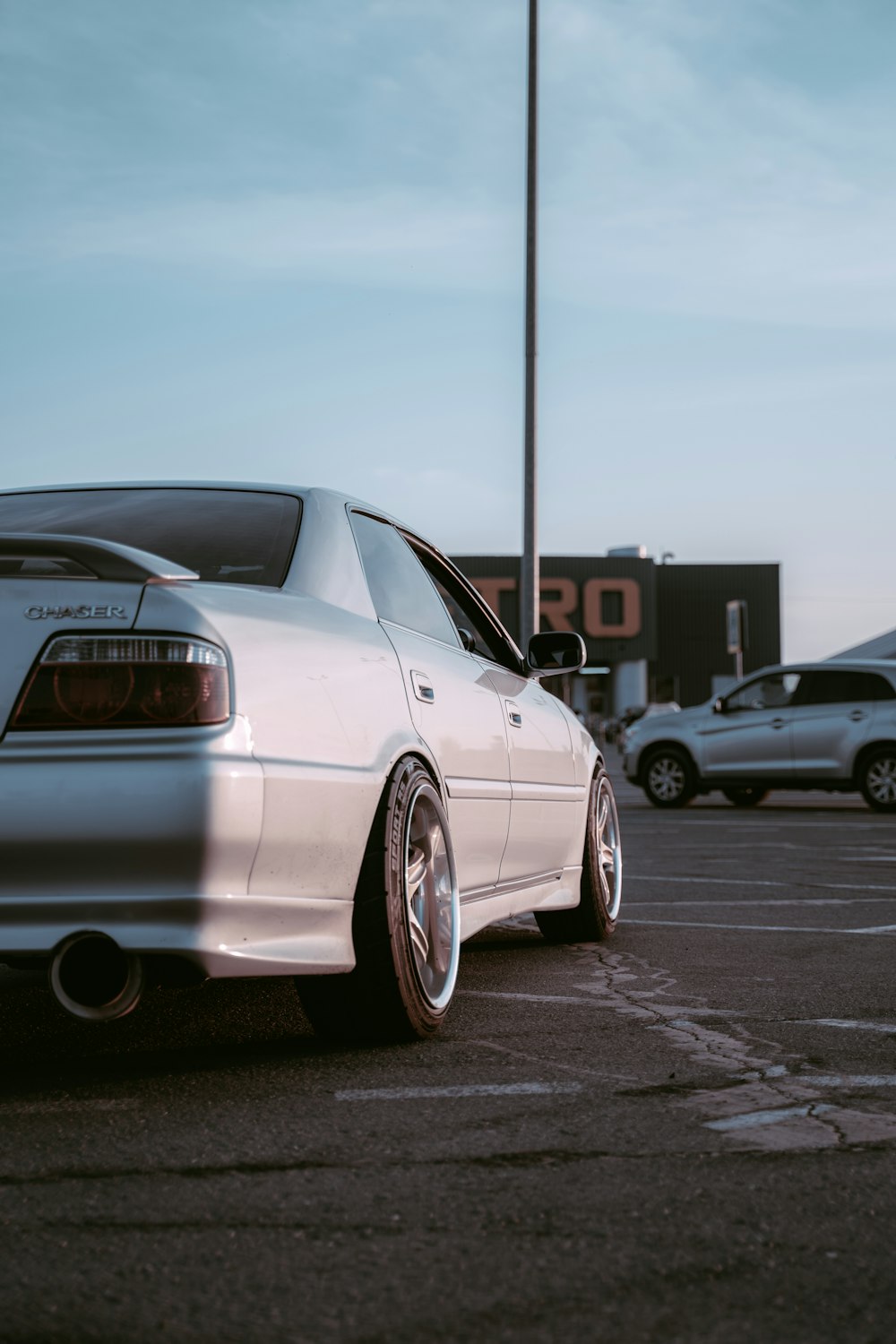 white bmw m 3 coupe parked on parking lot during daytime
