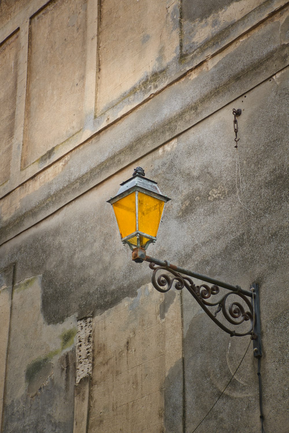 black metal sconce lamp on gray concrete wall